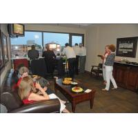 Fans enjoying an Arkansas Travelers game from a suite
