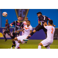 Las Vegas Lights FC's Carlos Alvarez (7) leaps for possession vs. Tulsa Roughnecks FC