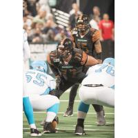 Arizona Rattlers defensive lineman Anttaj Hawthorne surveys the Philadelphia Soul offense