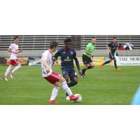 Michee Ngalina of Bethlehem Steel FC battles for possession against New York Red Bulls II
