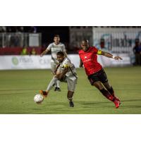 Sacramento Republic possesses the ball against Didier Drogba and Phoenix Rising FC