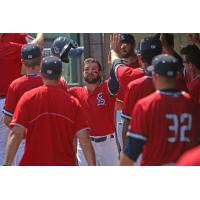 Jaff Decker receives congratulations from Syracuse Chiefs teammates