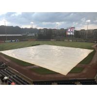 The tarp covers the field at Coolray Field, home of the Gwinnett Stripers