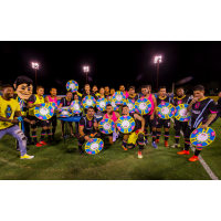 Las Vegas Lights FC players celebrate on the field