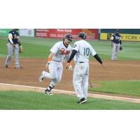 Taylor Ard and Kevin Baez of the Long Island Ducks exchange a low five