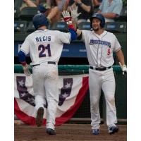 Cody Regis high fives Conrad Gregor in a Rockland Boulders' win