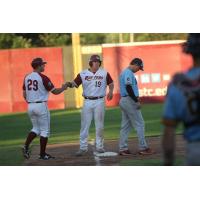 Jack-Thomas Wold of the Wisconsin Rapids Rafters is greeted at third