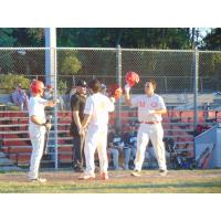 Jack Harris of the Geneva Red Wings receives congratulations on his way home