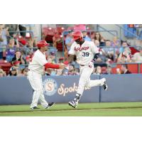 Spokane Indians outfielder Starling Joseph receives congratulations while rounding third