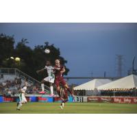 Sacramento Republic FC defender Justin Schmidt goes high for the ball vs. OKC Energy FC