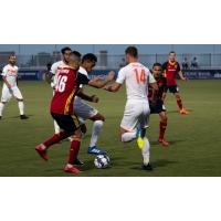 Josh Morton and Jesus Fereirra of Tulsa Roughnecks FC battle for possession in Saturday's 3-2 loss to the Real Monarchs