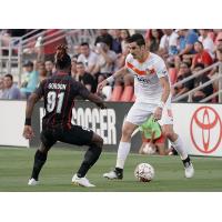 Nemanja Vukovic of the Tulsa Roughnecks faces a San Antonio FC defender