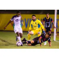 Las Vegas Lights FC's Thomas Olsen (in yellow) and Joseph Patrick Perez vs. OKC Energy FC