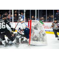 Brad Malone of the Bakersfield Condors collides with San Antonio Rampage goaltender Jordan Binnington as the Condors tie the game