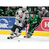 Jordan Kyrou of the San Antonio Rampage races for a puck against Texas Stars forward Erik Condra