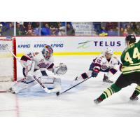 Bowen Byram of the Vancouver Giants (44) puts the pressure on the Regina Pats