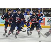 Macon Mayhem wall off the puck against the Roanoke Rail Yard Dawgs