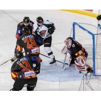 Rapid City Rush goaltender Adam Carlson stops a Utah Grizzlies shot