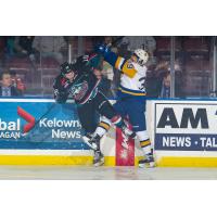 Kelowna Rockets RW Michael Farren (16) against the boards vs. the Saskatoon Blades