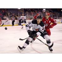 Allen Americans defenseman David Makowski (back) tries to get past the Rapid City Rush