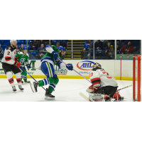 Binghamton Devils goaltender Cam Johnson stops a Utica Comets' shot
