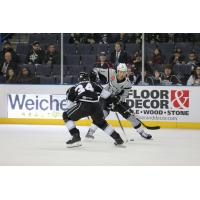 Jordan Nolan of the San Antonio Rampage (right) works against Ontario Reign defenseman Kale Clague
