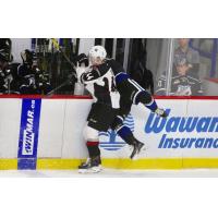 Vancouver Giants defenceman Bowen Byram checks a member of the Victoria Royals
