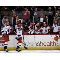 Allen Americans exchange congratulations after a Spencer Asuchak goal