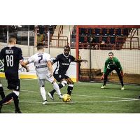 Mississauga MetroStars' Halburto Harris and Adrian Becic defend against the Harrisburg Heat's Vesko Konov