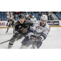Vancouver Giants defenceman Kaleb Bulych (left) vs. the Kamloops Blazers