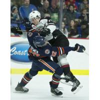 Vancouver Giants defenceman Kaleb Bulich delivers a hit against the Kamloops Blazers