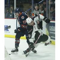 Vancouver Giants center Jadon Joseph (right) fights for the puck against the Kamloops Blazers