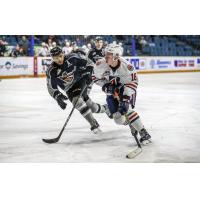 Vancouver Giants defenceman Alex Kannok Leipert (left) vs. the Kamloops Blazers