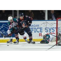 Kelowna Rockets centre Ethan Ernst (left) battles the Kamloops Blazers