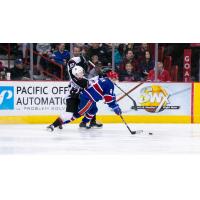 Vancouver Giants right wing Lukas Svejkovsky tries to get by the Spokane Chiefs