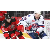 Binghamton Devils center Ryan Schmelzer (left) against the Rochester Americans