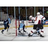 Cleveland Monsters press Milwaukee Admirals goaltender Troy Grosenick