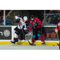 Vancouver Giants left wing Owen Hardy (left) battles the Kelowna Rockets