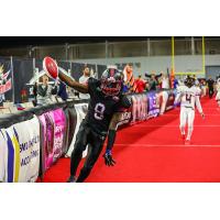 Dominique Carson of the Texas Revolution scores a touchdown
