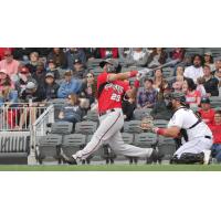 Eddie Silva of the Carolina Mudcats connects against the Fayetteville Woodpeckers