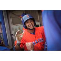 Grégor Blanco celebrates in the Syracuse Mets dugout after homering to lead off the bottom of the first inning on Tuesday night