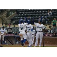 Jackson Lueck of the Lexington Legends receives high fives after his homer