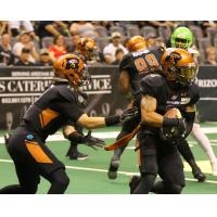 Arizona Rattlers quarterback Jeff Ziemba (left) hands the ball off