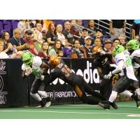 Phillip Henry of the Arizona Rattlers makes a tackle against the boards vs. the Nebraska Danger