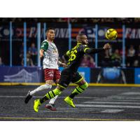Milwaukee Wave Forward Ian Bennett (right) eyes the ball against the Monterrey Flash