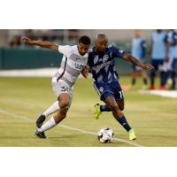 Sacramento Republic FC defender Jordan McCrary (left) against Fresno FC