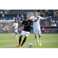 Tacoma Defiance forward Justin Dhillon (left) battles for possession