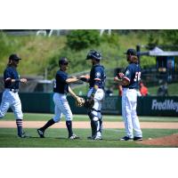 Tacoma Rainiers exchange congratulations following Sunday's win