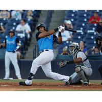 Dermis Garcia swings away for the Tampa Tarpons