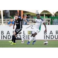 OKC Energy FC midfielder Je-Vaughn Watson (right)